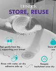 Hand washing a breast cup with water from a faucet, featuring text on how to use and store it.